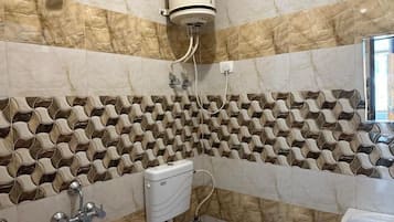 Economy Double Room | Bathroom | Shower, towels