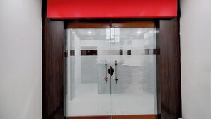 A double door with a red upper section, likely leading to a room or hallway.