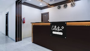 A reception desk with a sign indicating it's a company-serviced collection point.