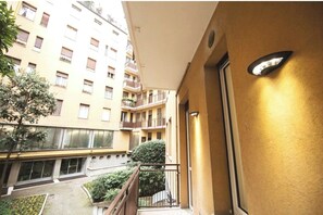 A multi-story building with balconies, a courtyard, and a building facade. - Duomo & Fashion District -Elegant & Quiet Flat (Milano)