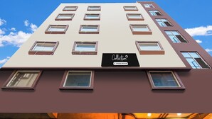 A multi-story building with a sign indicating it is a company-serviced collection. - Super Collection O City Center 2 (Barasat)