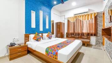 Deluxe Double Room, City View | In-room safe, desk, laptop workspace, iron/ironing board