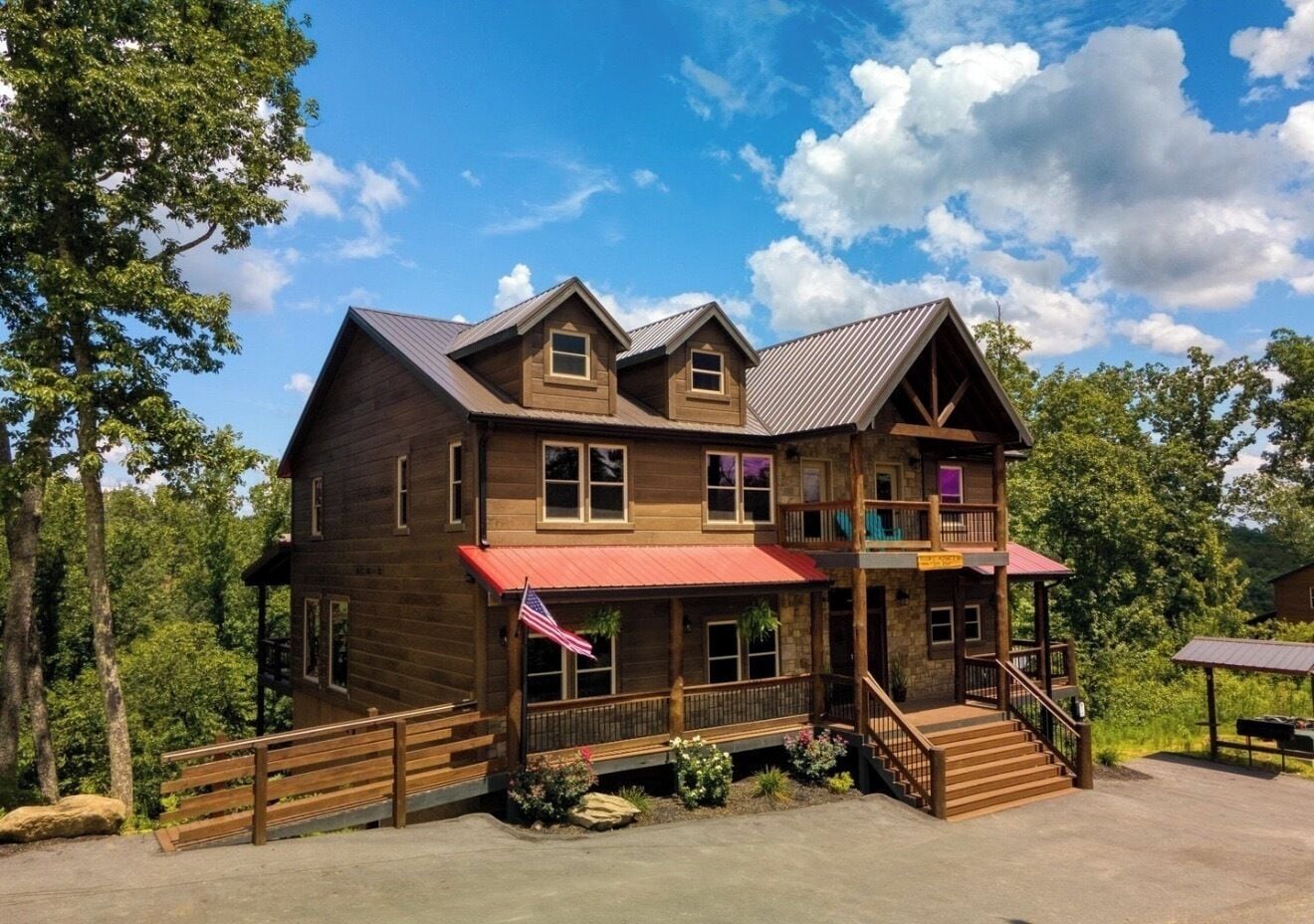 Spacious mountain cabin with wraparound porches and peaceful wooded views