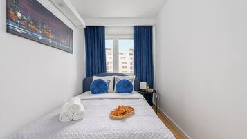 Comfort Apartment, Courtyard View | Premium bedding, laptop workspace, blackout drapes, iron/ironing board