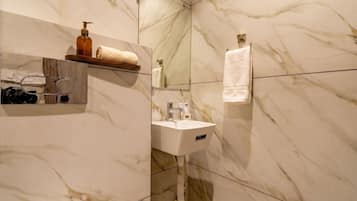 Suite, 1 King Bed, Smoking, Private Bathroom | Bathroom | Free toiletries, slippers, towels, soap