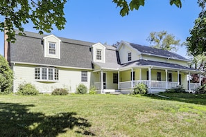 A two-story house with a porch and a covered front porch area. - Perfect Family Retreat: Pool, Fire Pit (Westfield)