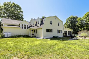 A two-story house with a front porch and a covered patio area. - Perfect Family Retreat: Pool, Fire Pit (Westfield)