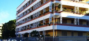 A multi-story hotel with balconies, a flat roof, and a fenced perimeter. - B&B DALLA ZIA (Bari)