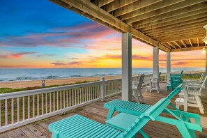 A wooden deck with outdoor seating and a view of the beach and ocean. - Gabriel's Landing - Beachfront 5 bedroom - incredible views, sleeps 18 (Crystal Beach)
