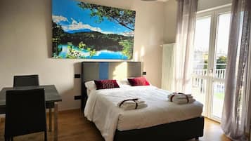 Comfort Studio | Premium bedding, down comforters, memory foam beds, in-room safe