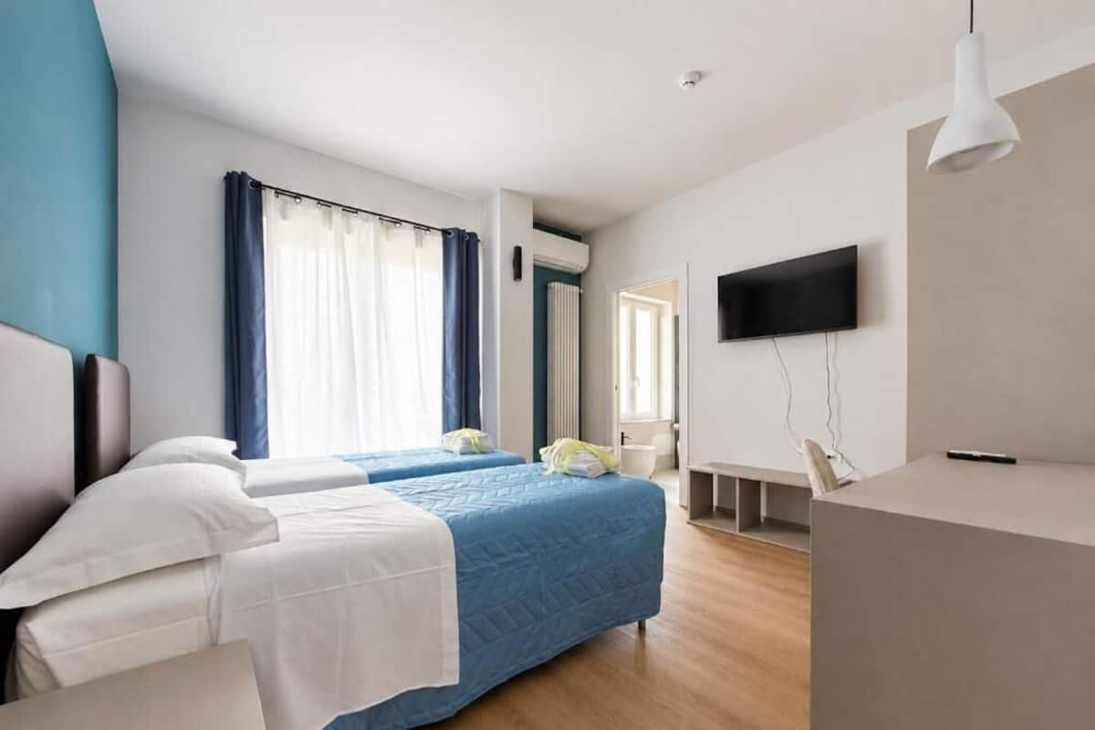 Comfort Twin kamer, 2 eenpersoonsbedden, balkon | Luxe beddengoed, donsdekens, bedden met traagschuimmatrassen