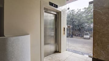 An elevator with a digital display indicating the ground floor.