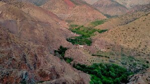 A mountainous landscape with a valley.