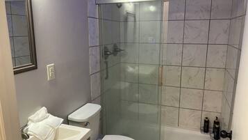 Shower, hair dryer, towels, soap