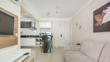 Basic Apartment | Living area | 40-inch TV with digital channels