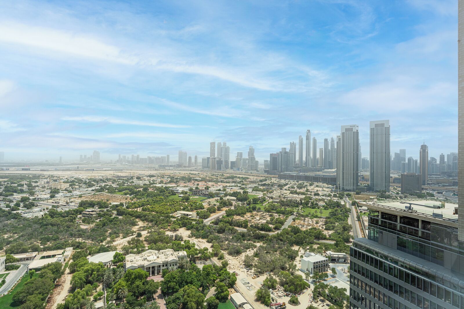 A high-rise building with multiple floors, large windows, and a modern architectural design.