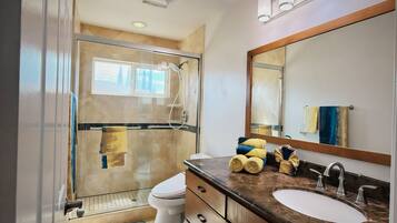 Shower, hair dryer, towels, toilet paper