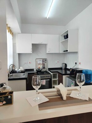Classic Apartment, Balcony | Private kitchen | Coffee/tea maker, microwave, oven, stovetop - The Enkang Urban Escape (Nairobi)