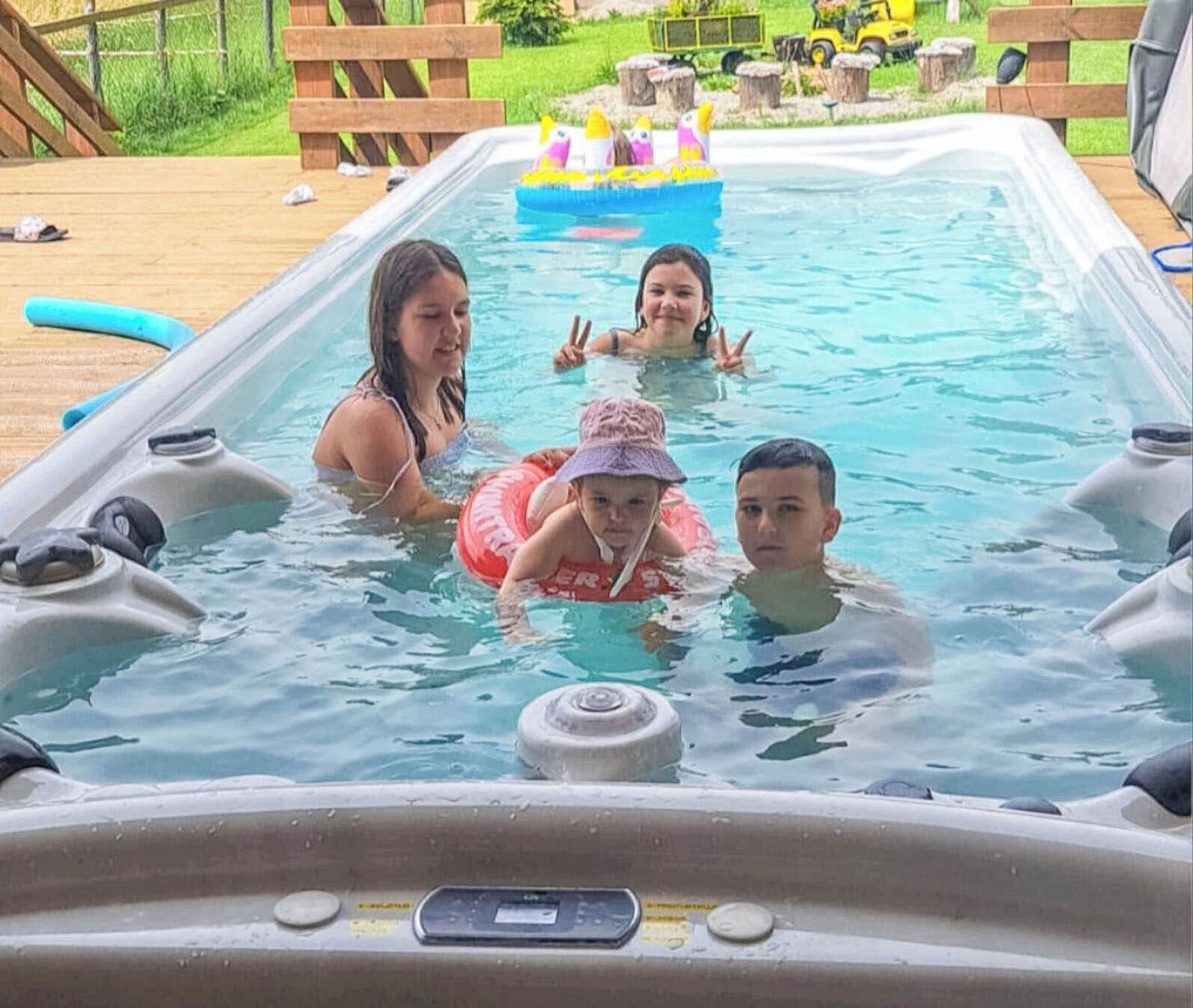 Outdoor pool, a heated pool, open open 24 hours a day, pool umbrellas
