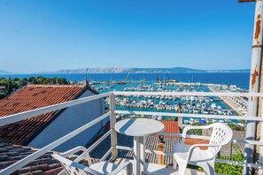 A balcony with a view of a marina and the sea. - House Arija (Novi Vinodolski)