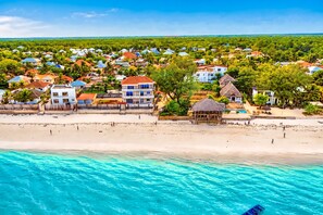 A coastal resort with beachfront villas, a swimming pool, and a beach. - Private 2-bedroom Beachfront Apartment in Uroa, Zanzibar (Uroa)
