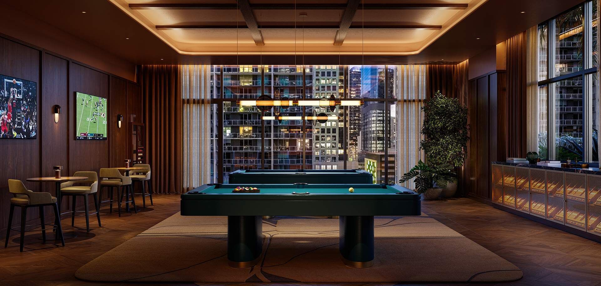 A pool table in a room with a city view, bar area, and large windows.