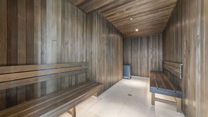 A wooden interior with benches and a trash bin. - Luxury CBD Stay, Pool, Spa & City Views (Melbourne)