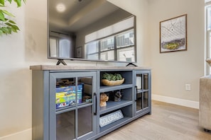 Gather around the entertainment console for movie night or game day. With plenty of storage and shelf space for your favorite snacks and games, you'll have everything you need for memorable evenings. - Arvada Townhome | Quiet Location | Fireplace (Arvada)