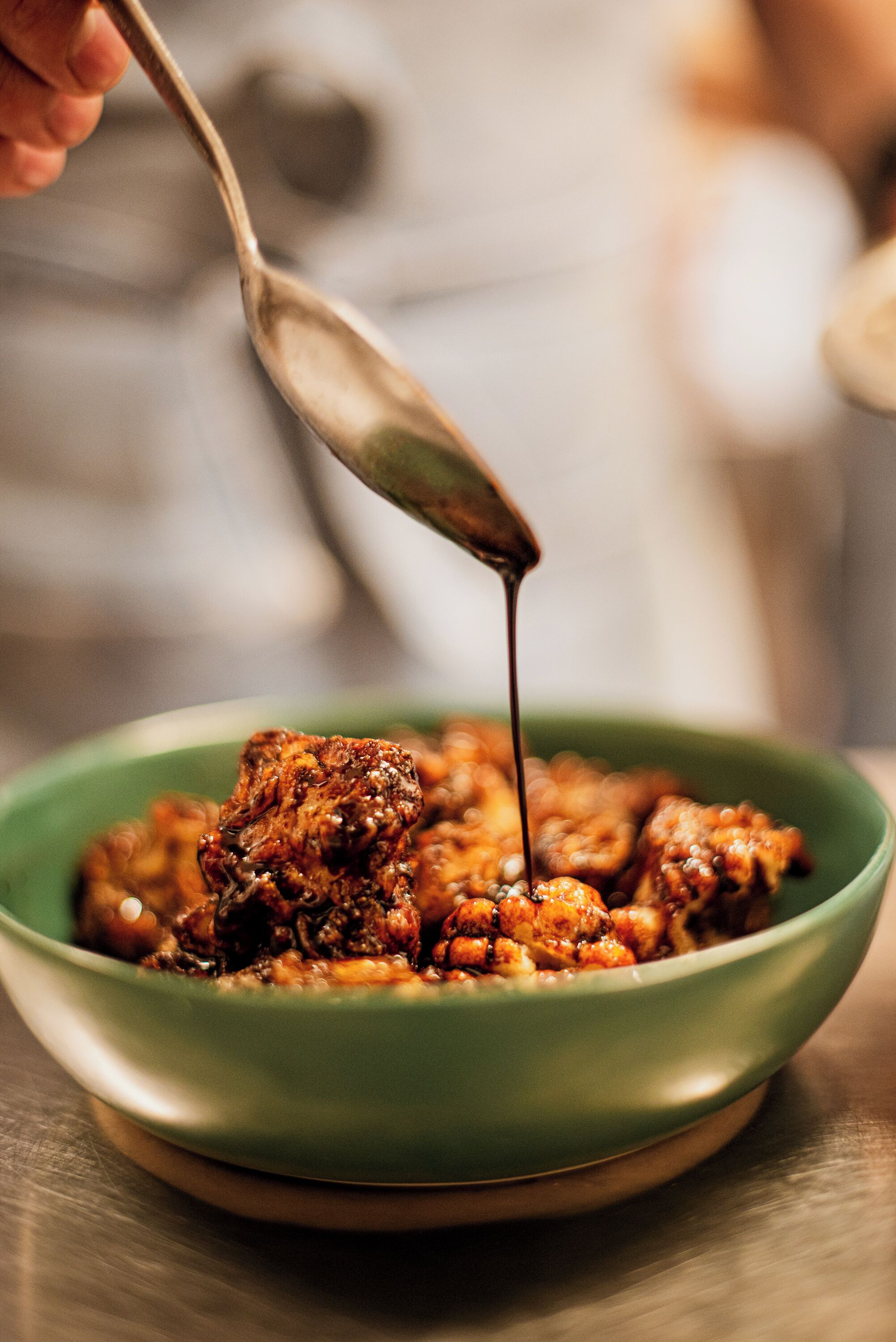 A bowl of food with a spoon.