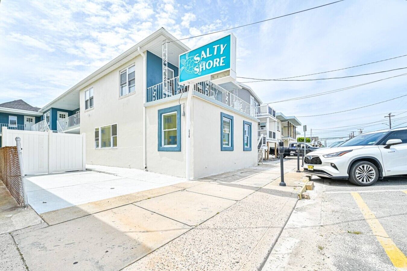 A two-story building with a sign that reads 'SALTY SHORE.'