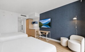 A modern hotel room with a bed, a desk, a chair, a TV, and a lamp. - 1905 - Hotel-Style Studio with Balcony & Pool in Downtown Miami (Miami)