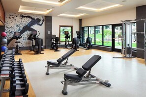 A gym with weight machines, dumbbells, and a bench. - Family-Friendly 2 Bedroom Villa at Kaua'i Resort (Koloa)