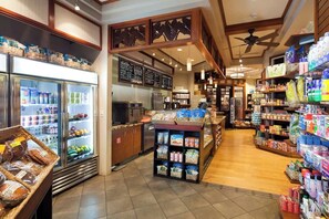 A grocery store interior with refrigerated sections, a bakery display, and shelves stocked with various products. - Princeville One Bedroom Villa Resort w/ Amenities (Princeville)