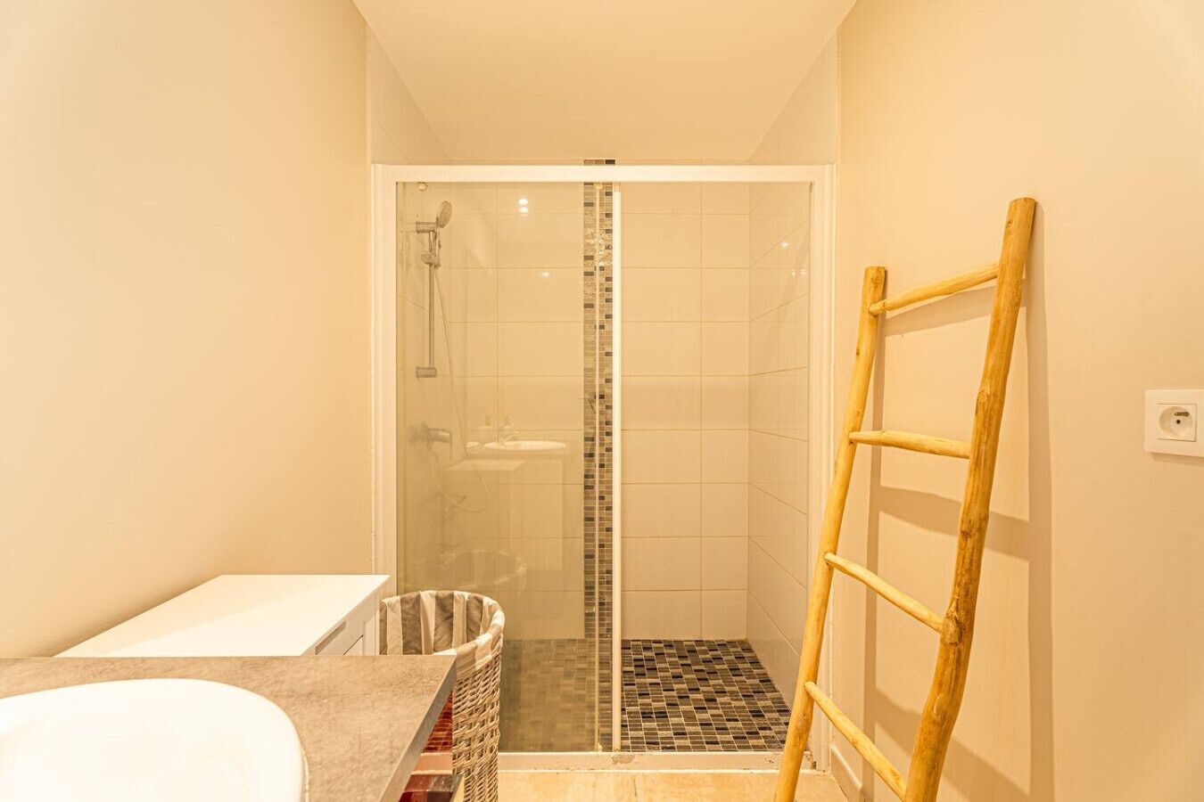 A bathroom with a shower, a bathtub, and a toilet.