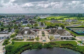 A residential area with houses, a swimming pool, and a large body of water. - Millville by the Sea- shuttle access Bethany beach (Millville)