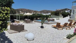 A rooftop terrace with outdoor seating, a pool, and a view of hills. - Seaview Apartment Galissas, Blue Lagoon Complex A9 (Galissas)