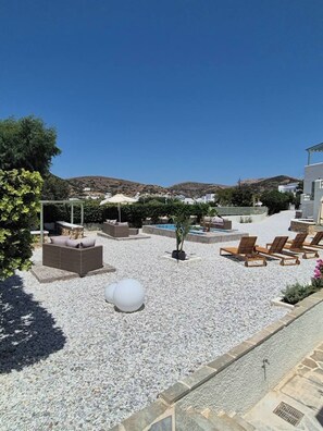 A rooftop terrace with outdoor seating, a pool, and a view of hills. - Seaview Apartment Galissas, Blue Lagoon Complex A9 (Galissas)