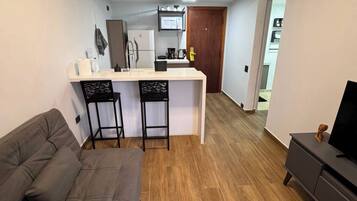 Suite Studio Confort, vue ville | Coin séjour