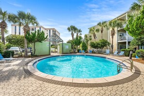 A swimming pool with a no diving sign, surrounded by lounge chairs and palm trees. - 3BR/3Bath, Steps to Private Beach Access! (Destin)