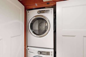 A compact, wall-mounted washer and dryer unit with a control panel and a digital display. - Lovely 3BR Oregon Wine Country - Washer & Dryer (McMinnville)