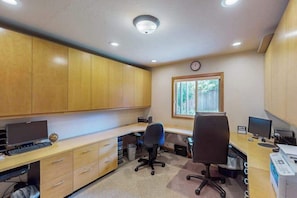 A modern office with two desks, chairs, and a clock on the wall. - Delightful 2BR Lakefront - Patio (Lake Oswego)
