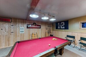 A pool table with a red felt surface, surrounded by wooden walls with a wooden ceiling. - Woodland 2BR Mountainview Dog Friendly - Deck (Leavenworth)