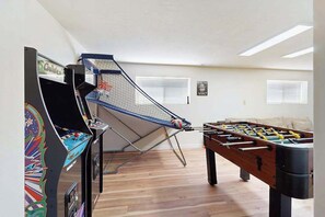A room with a foosball table and a table tennis table. - 3BR Home & Bunk Room with hot tub, mountain views (East Wenatchee)