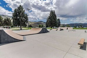 A skate park with ramps and benches.