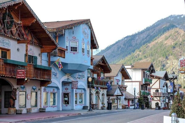 A traditional European town with wooden buildings, balconies, and a mountainous backdrop. - 1 BR condo located in Icicle Village, Leavenworth (Leavenworth)