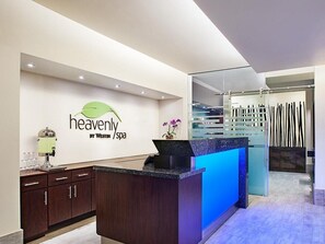 A reception area with a counter, a coffee machine, and a wall sign that reads 'heavenly by Westin spa'. - Cancun One Bedroom Villa Westin Lagunamar Resort (Cancún)