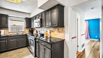 Coffee/tea maker, fridge, microwave, oven