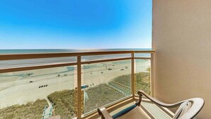 A balcony with a view of a beach and a road. - Bahama Sands Unit 0707 (North Myrtle Beach)