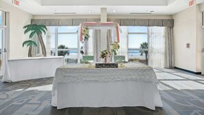 A room with a bed, a window with a view of the beach, and an 'EXIT' sign. - Bay Watch Resort 0513 (North Myrtle Beach)