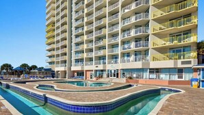 A multi-story hotel with a swimming pool area featuring a 3 FT depth limit. - Bay Watch Resort 0514 (North Myrtle Beach)